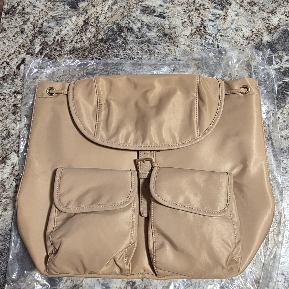 Year of Ours chic preppy coquette minimalist scandinavian style tan backpack